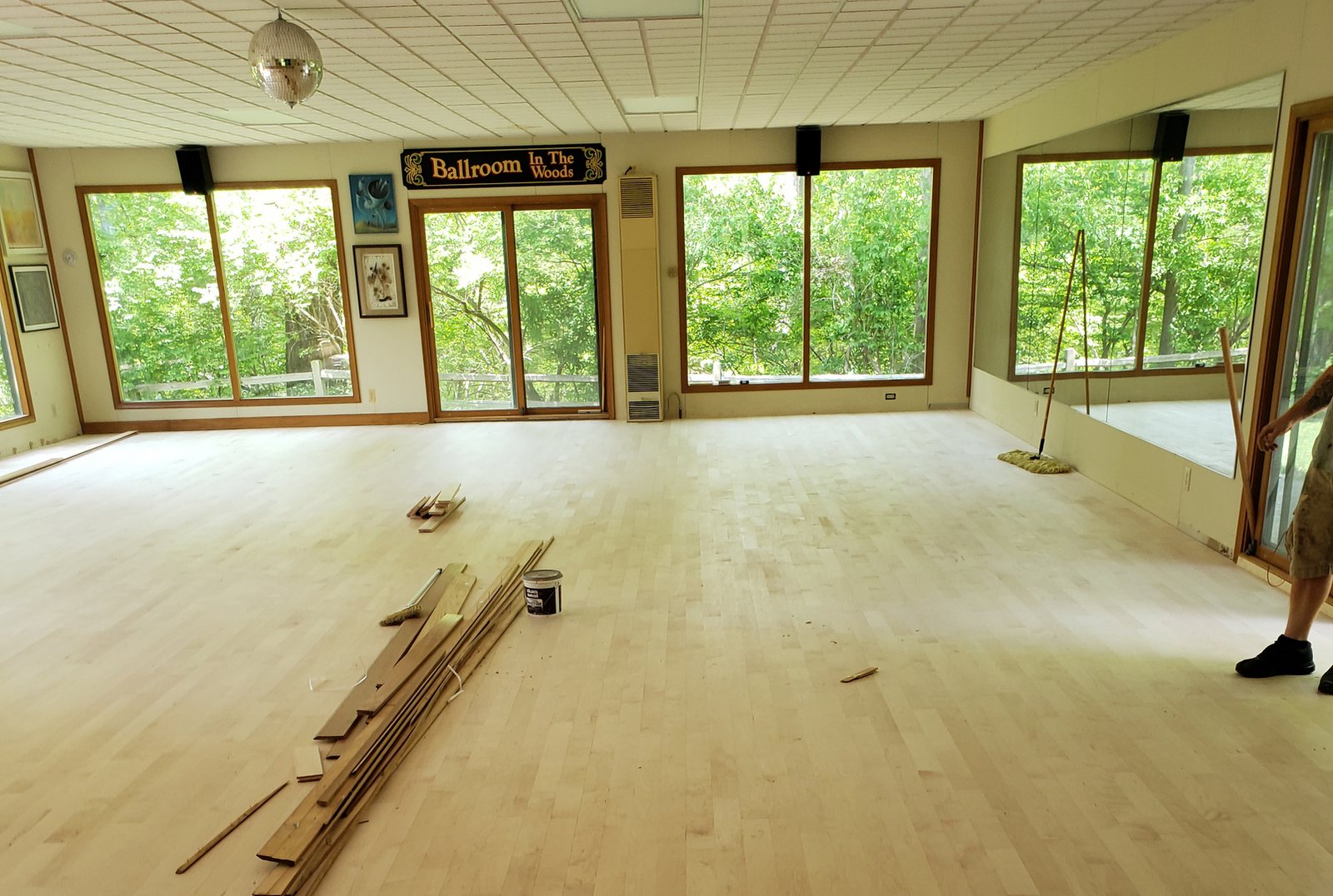 New red oak flooring going down in a studio before sanding