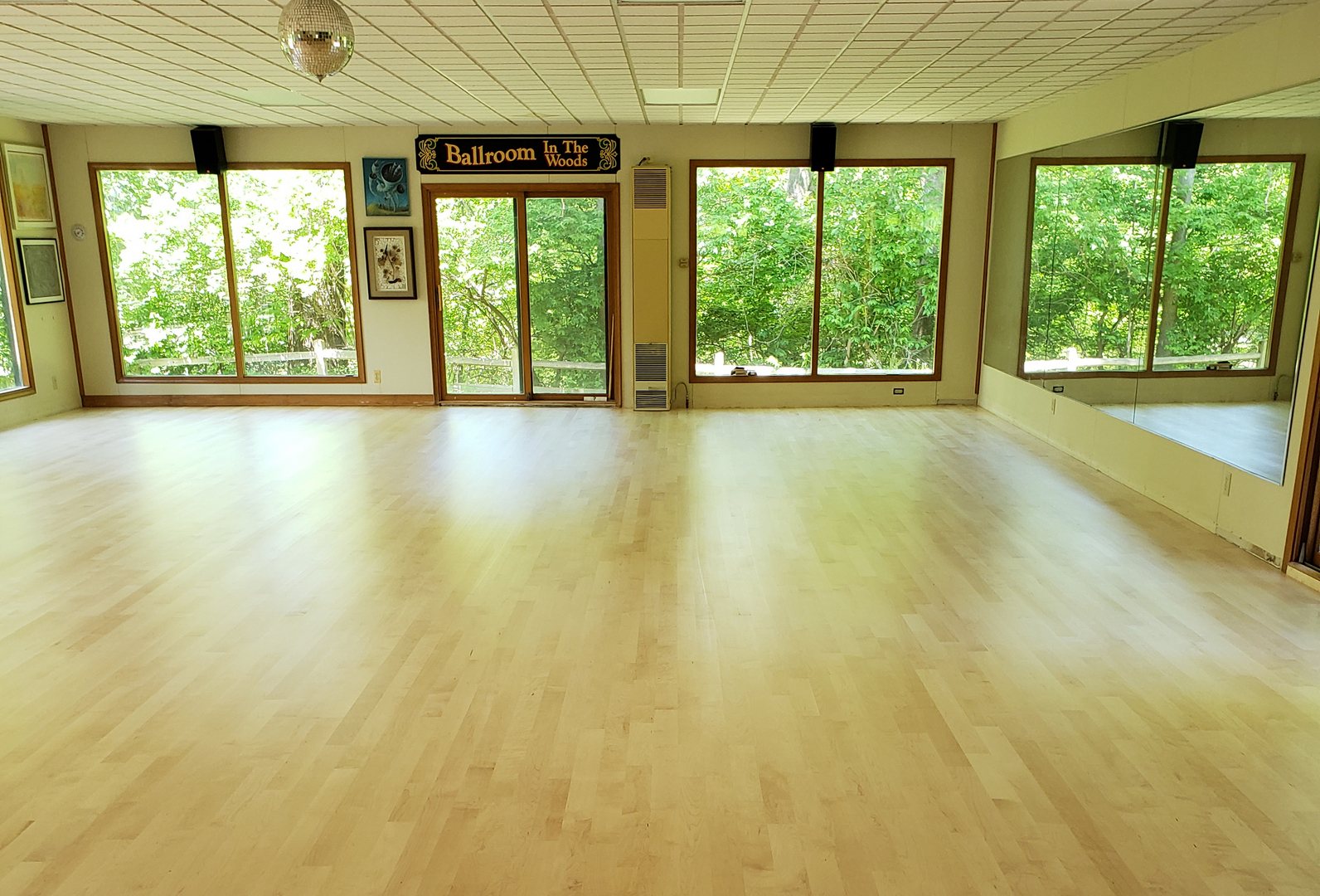 Finished hardwood studio floor with big windows