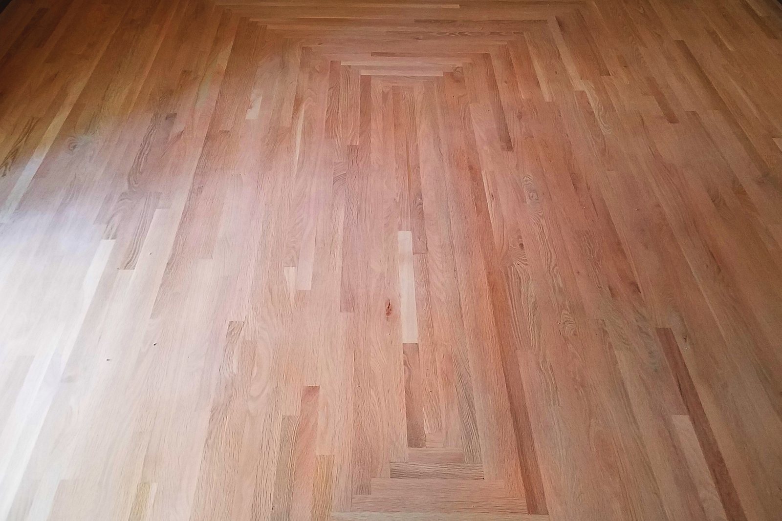 Freshly installed natural red oak flooring by Floormaster